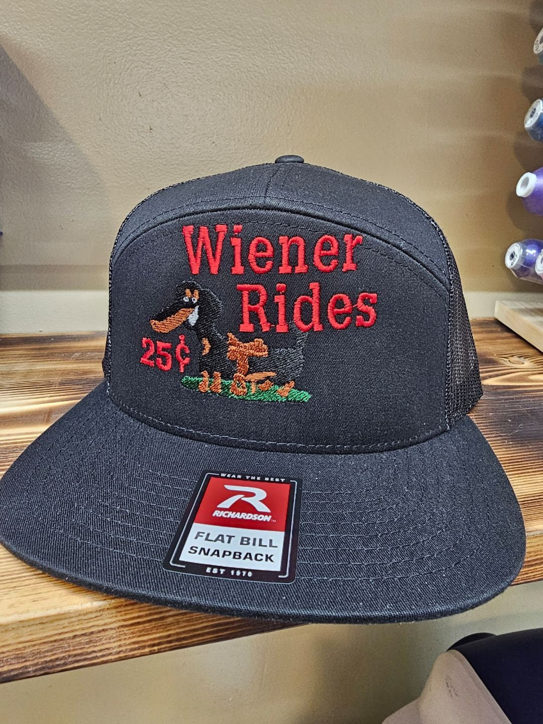 Embroidered weiner rides on a Richardson 112 trucker round bill or 168 flat bill hat