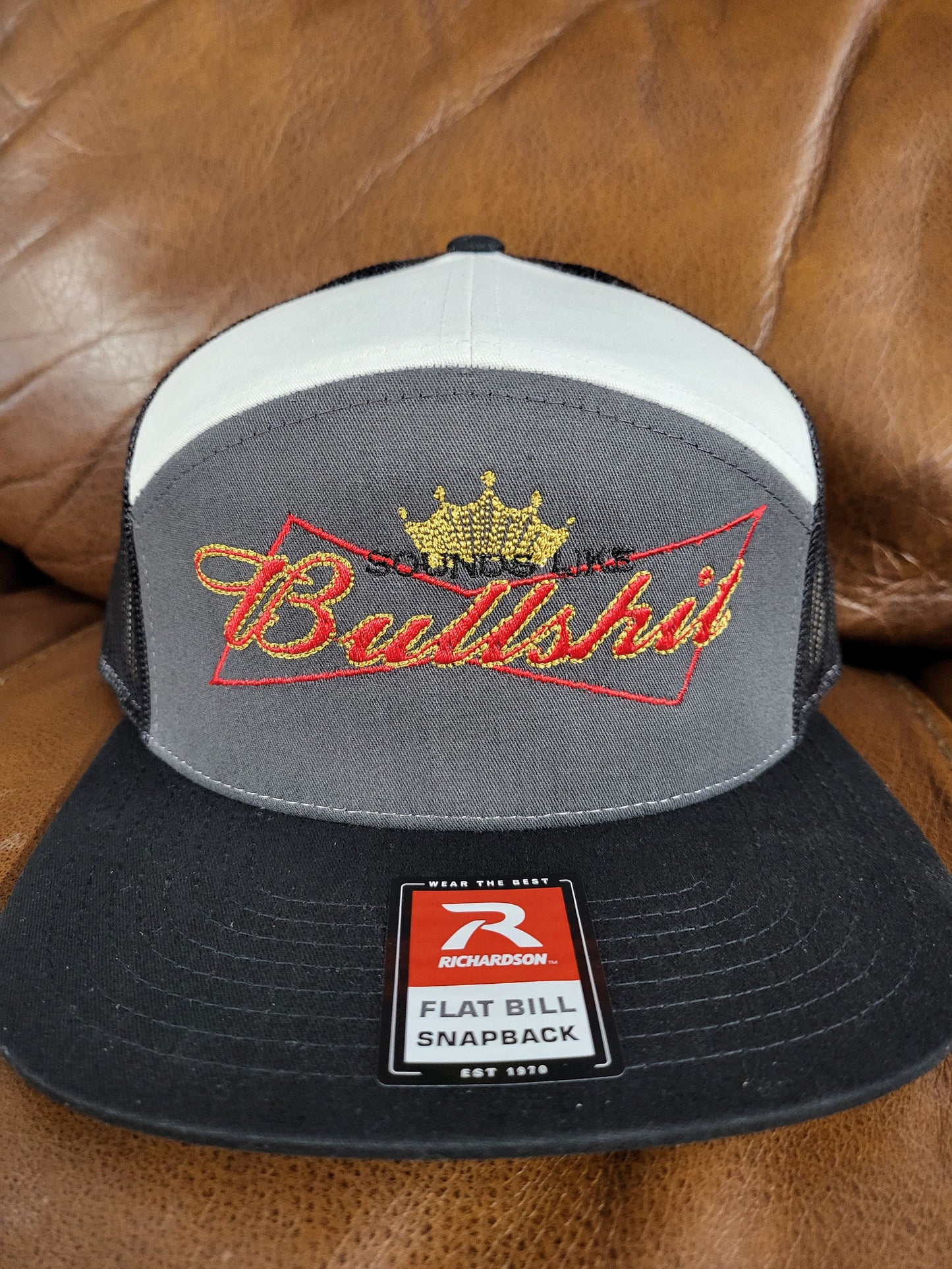 Sounds Like Bullshit embroidered hat on a Richardson 112 trucker round bill or 168 flat bill hat