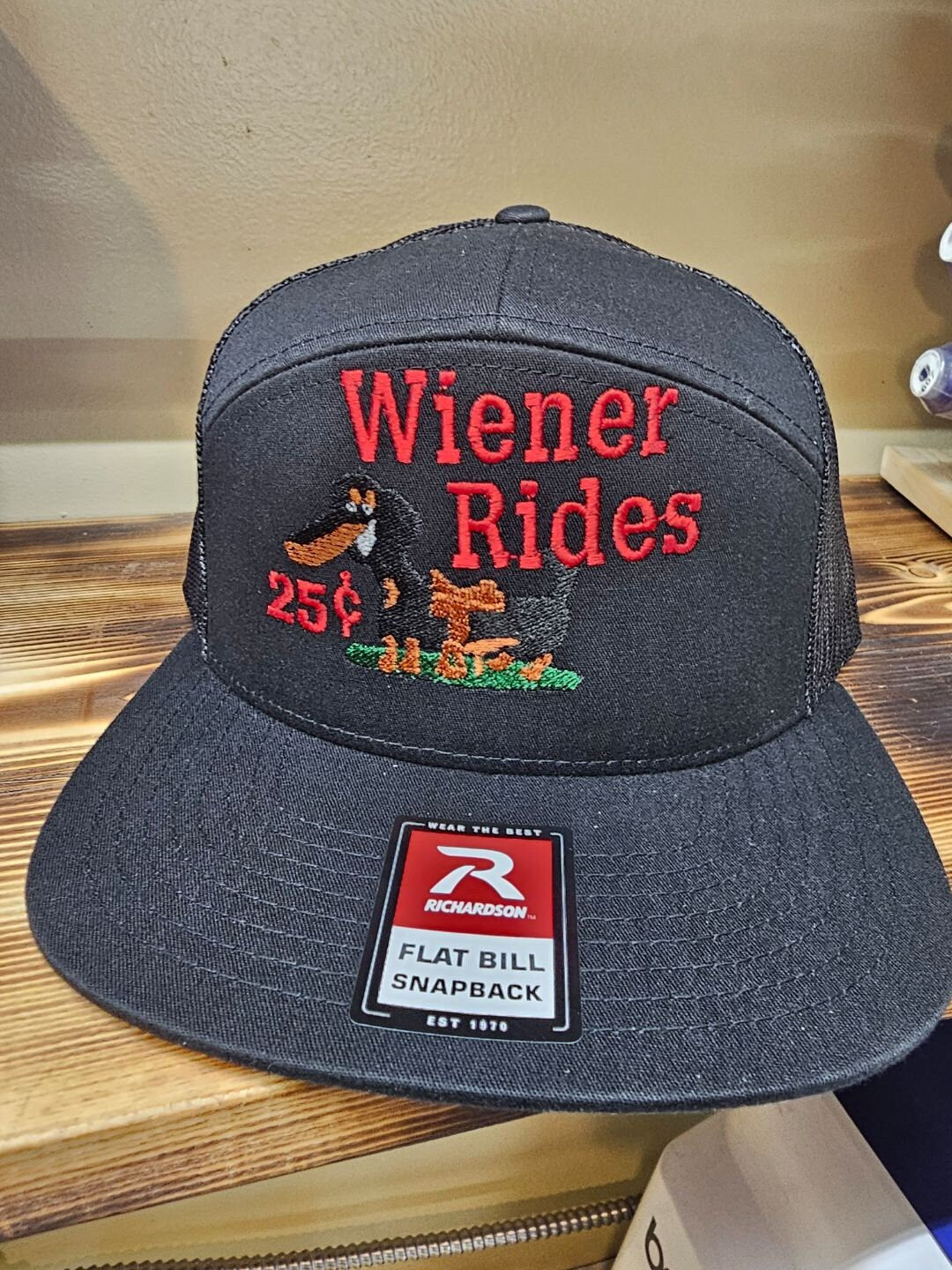 Embroidered weiner rides on a Richardson 112 trucker round bill or 168 flat bill hat