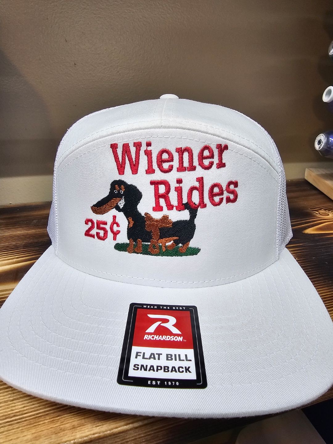 Embroidered weiner rides on a Richardson 112 trucker round bill or 168 flat bill hat