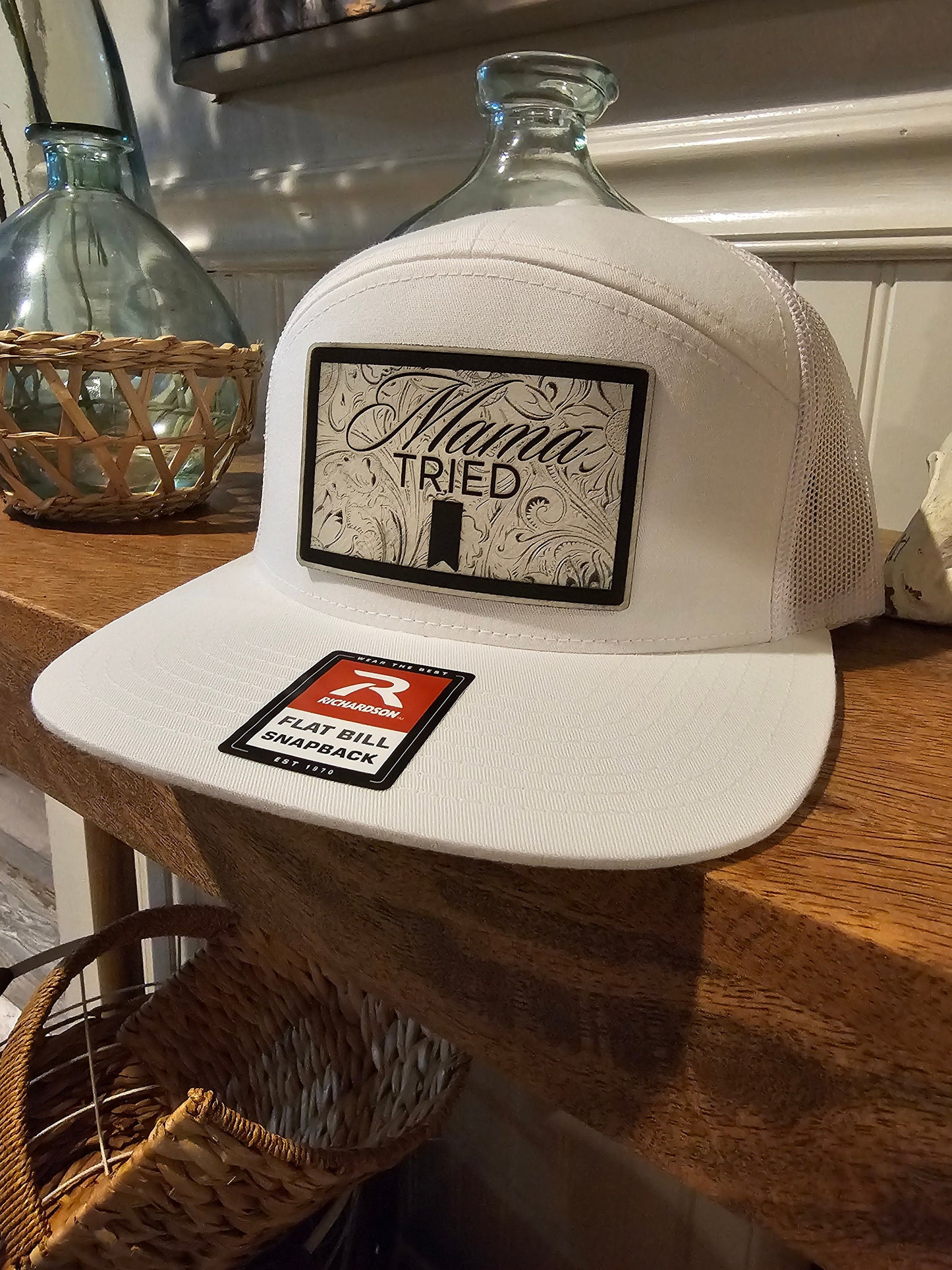 Mama Tried Mama Tried all white leather on a white Richardson 112 trucker round bill or 168 flat bill hat