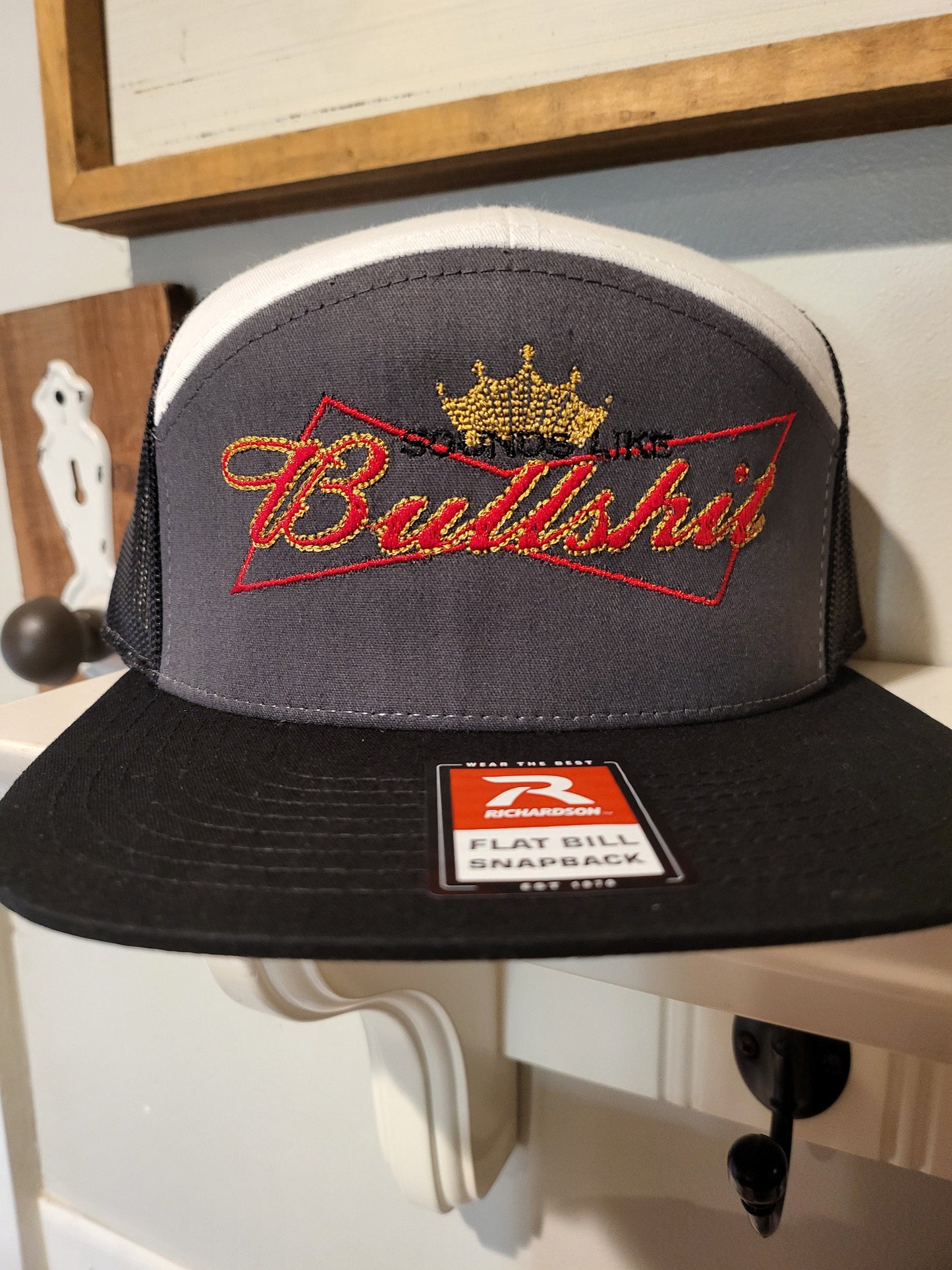 Sounds Like Bullshit embroidered hat on a Richardson 112 trucker round bill or 168 flat bill hat