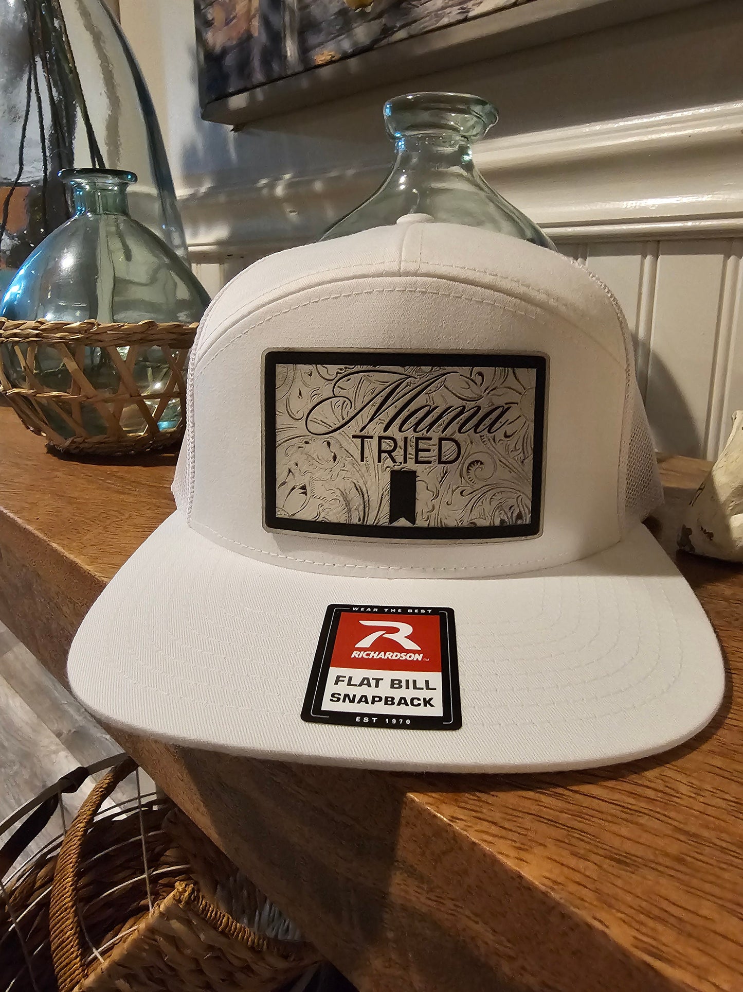 Mama Tried Mama Tried all white leather on a white Richardson 112 trucker round bill or 168 flat bill hat
