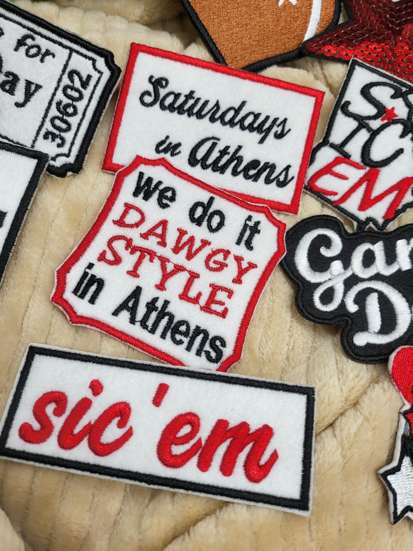 Bulk iron-on embroidered patches in a variety of styles. Embroidered on felt.