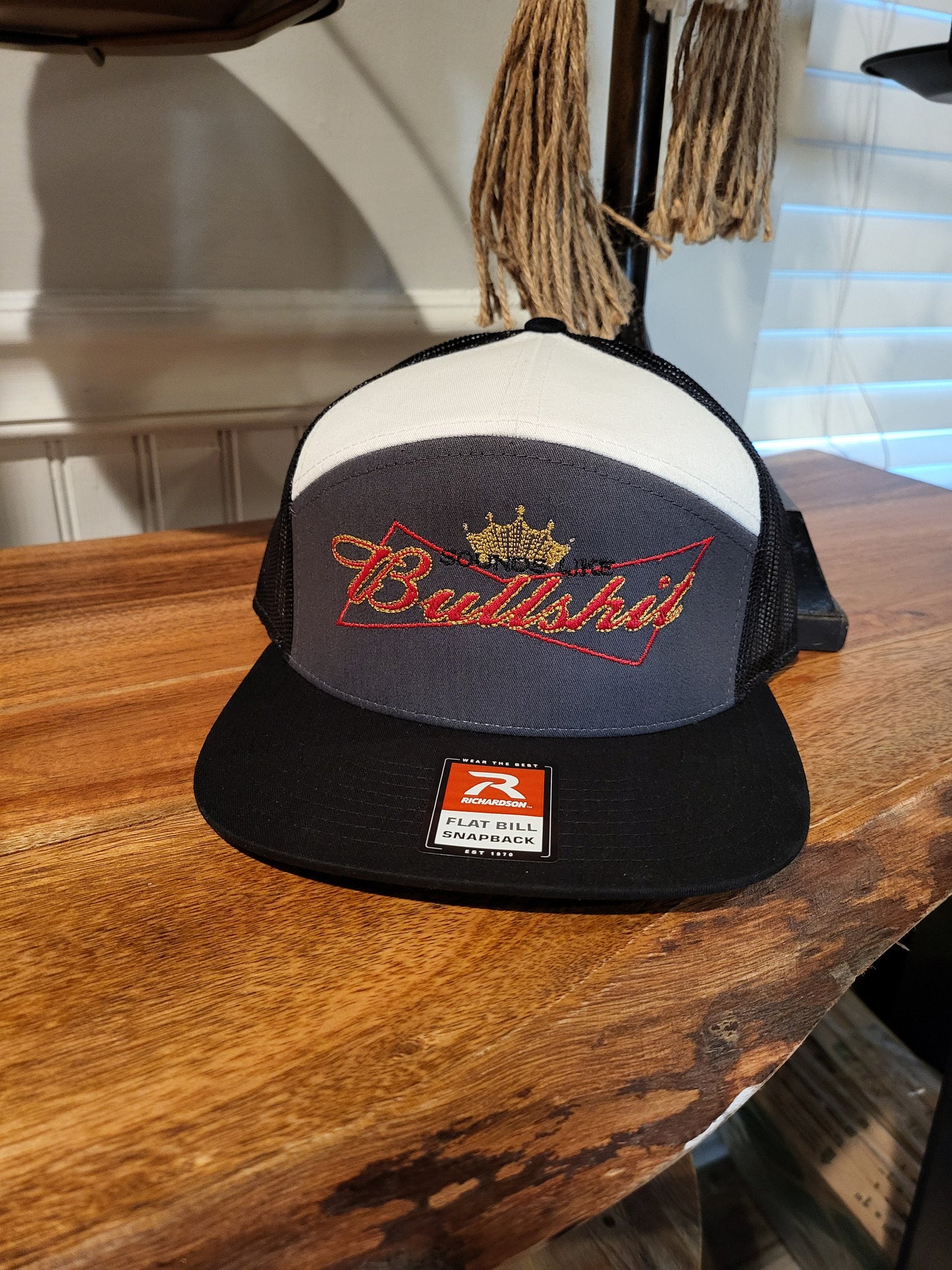 Sounds Like Bullshit embroidered hat on a Richardson 112 trucker round bill or 168 flat bill hat