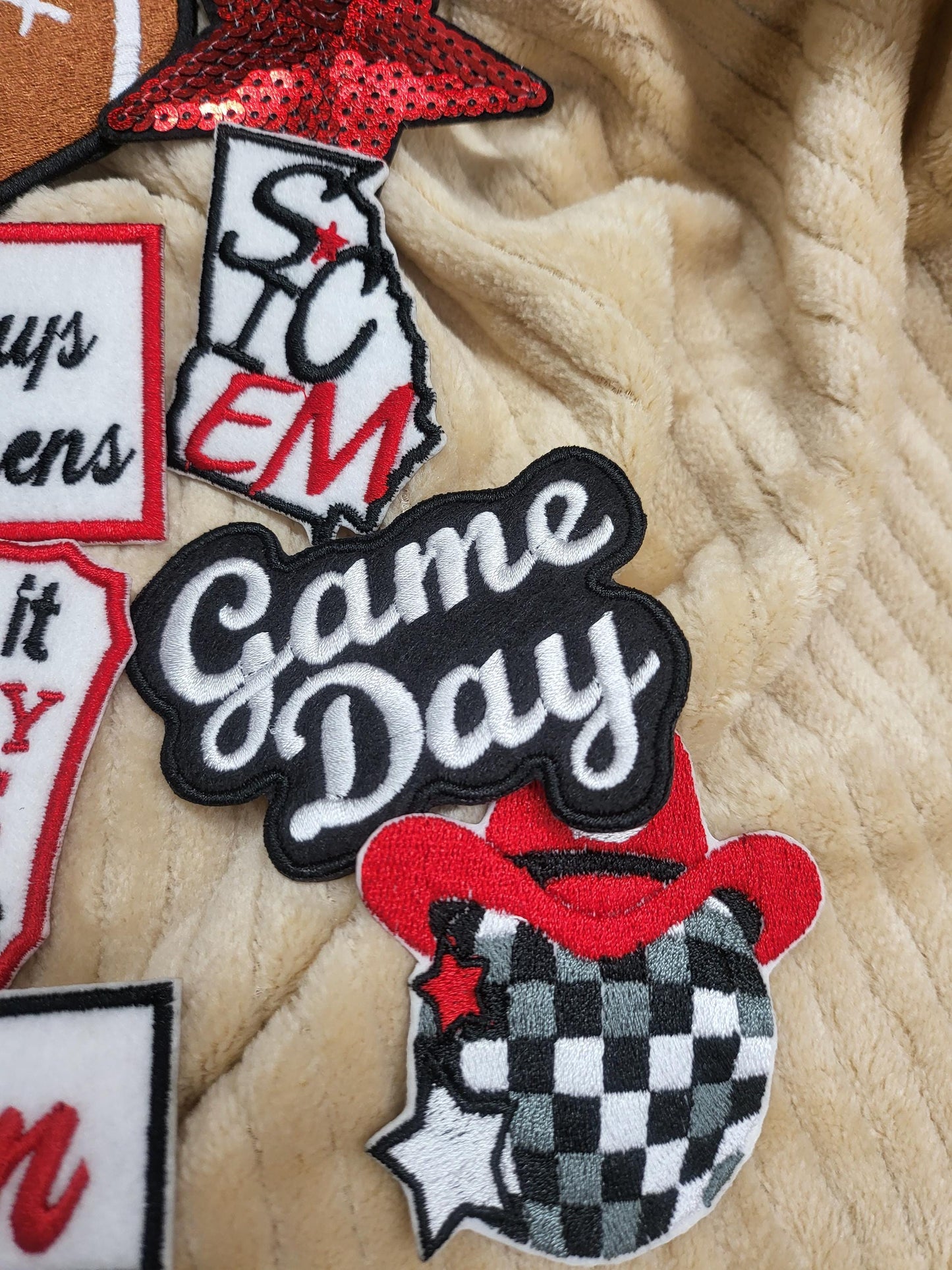 Bulk iron-on embroidered patches in a variety of styles. Embroidered on felt.
